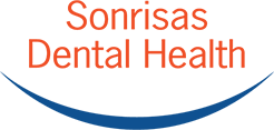Sonrisas Dental Health is clearly written in orange text. It sits above a parentheses in the shape of a smile. 